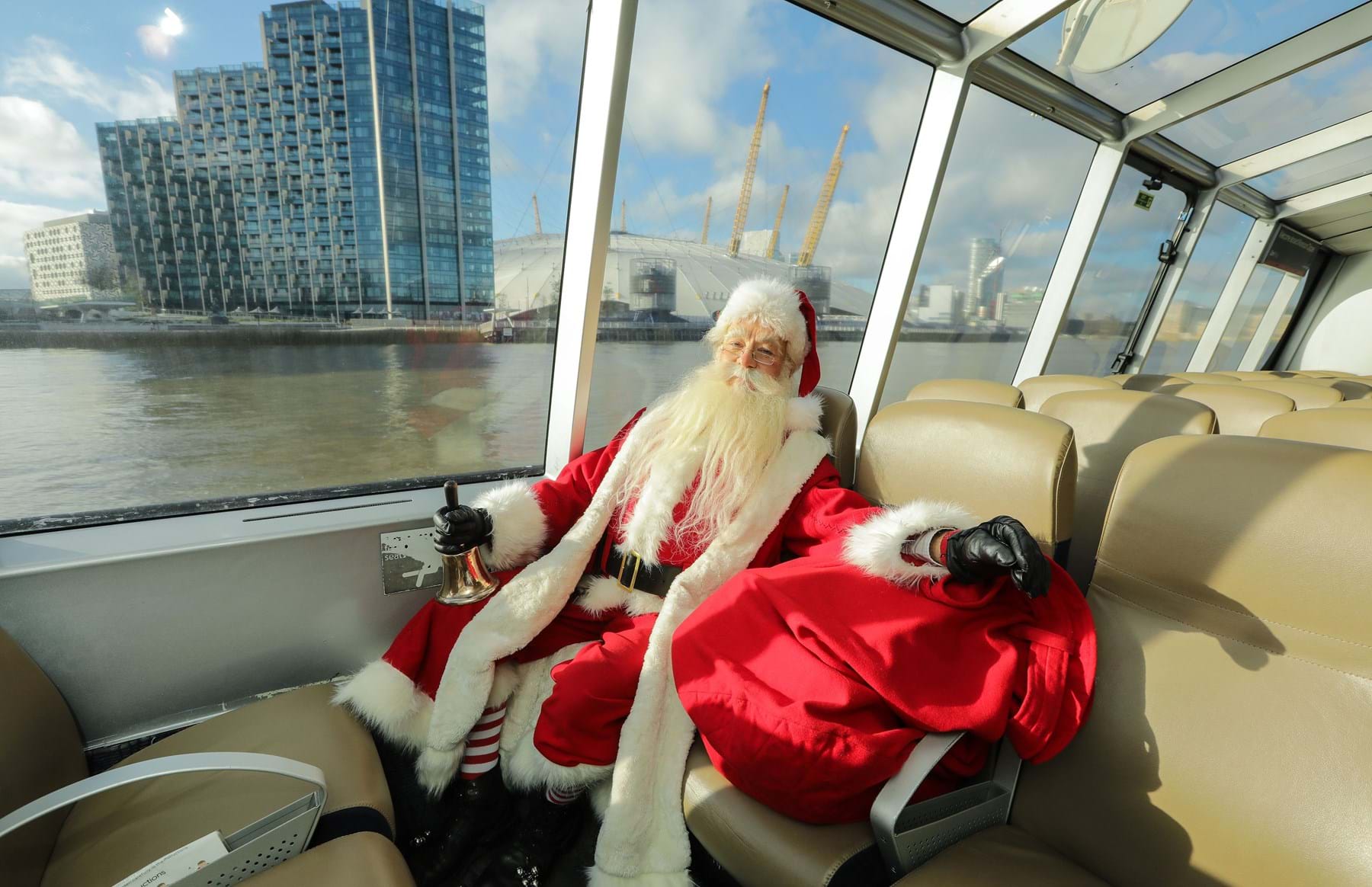 Santa Claus on board with The O2 in the background
