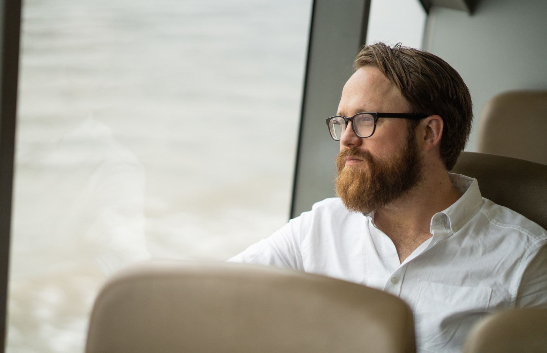 Man seating by the window