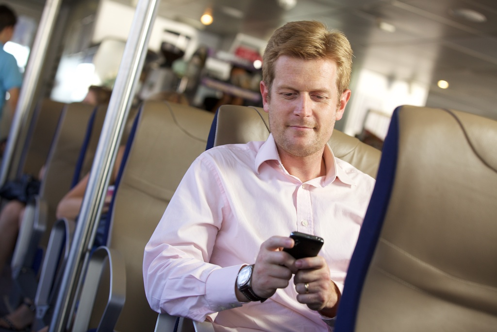 Commuter checking their phone