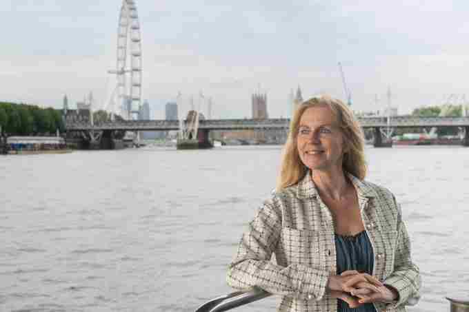 Woman outside deck with London Eye in the background