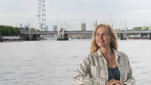 Woman outside deck with London Eye in the background