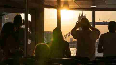 Passengers Photographing Sunset