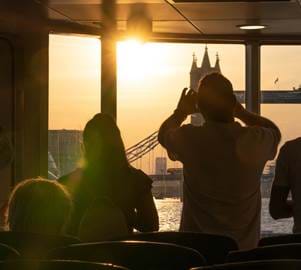Passengers Photographing Sunset