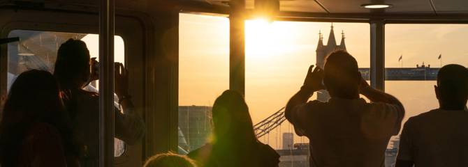 Passengers Photographing Sunset