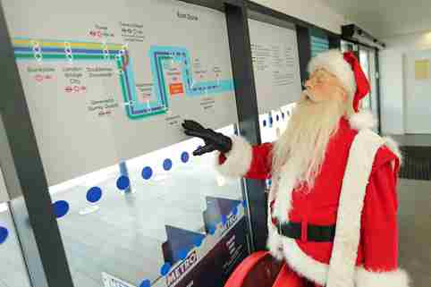 Santa Claus checking route map at North Greenwich Pier